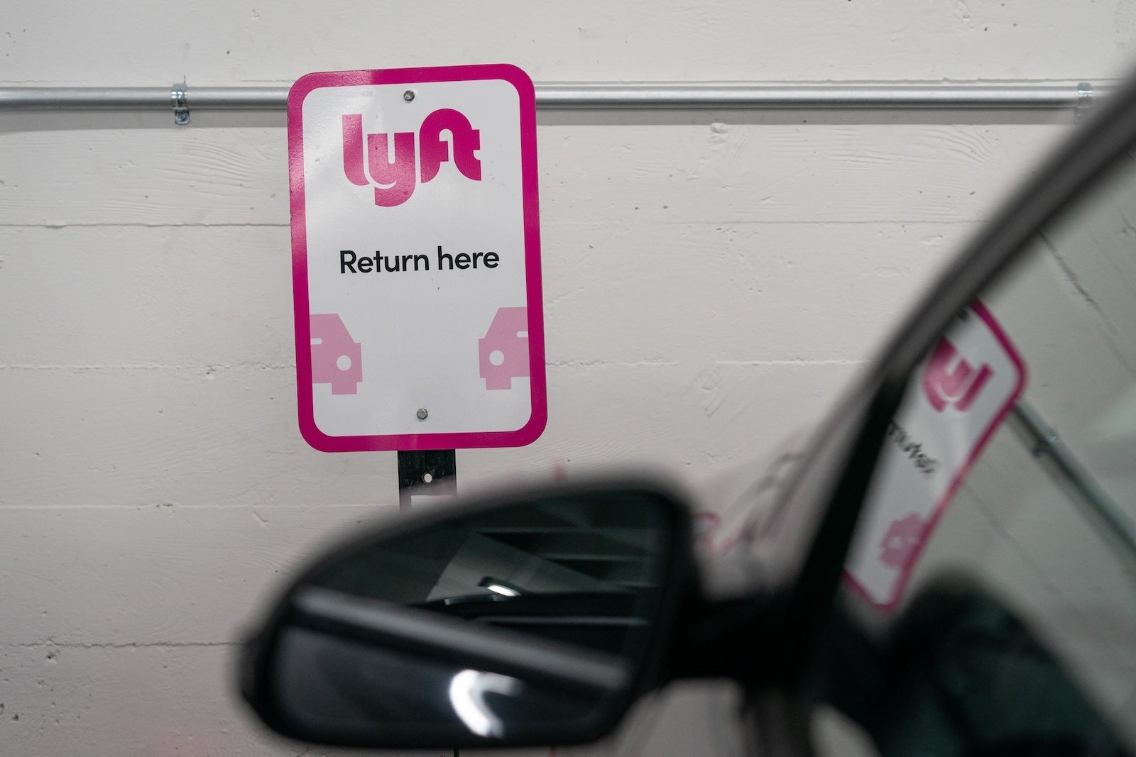 Lyft signage at a vehicle rental location in San Francisco, California, US, on Thursday, Feb. 8, 2024. Lyft Inc. is scheduled to release earnings figures