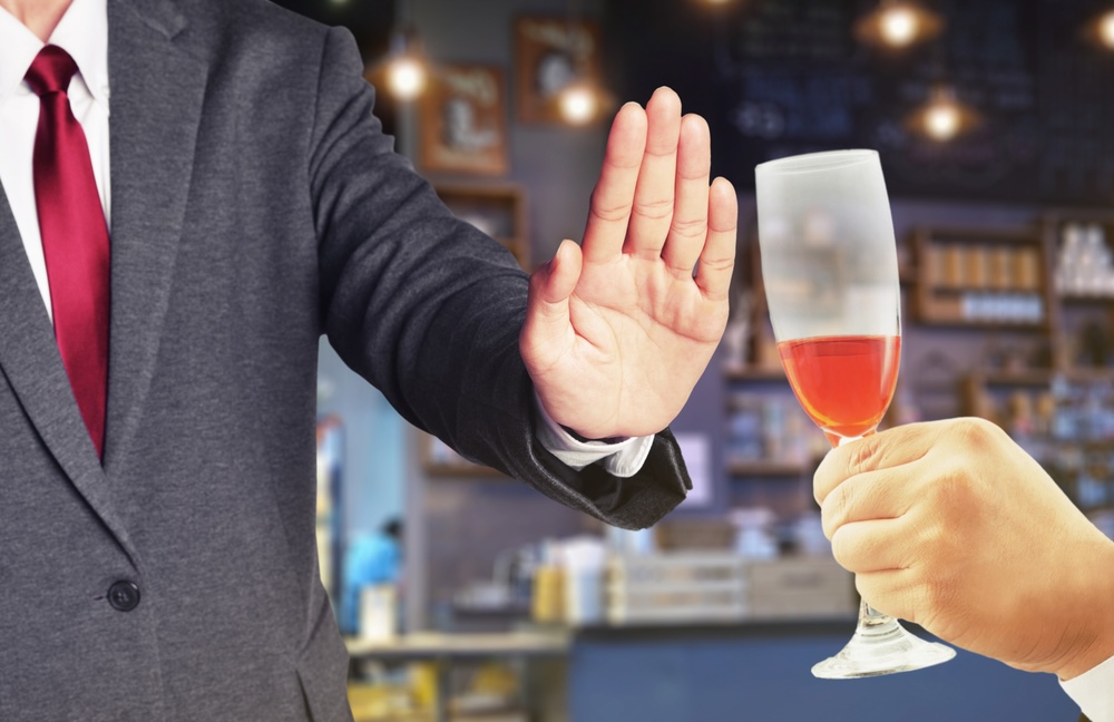 Guest refusing alcohol during a holiday event