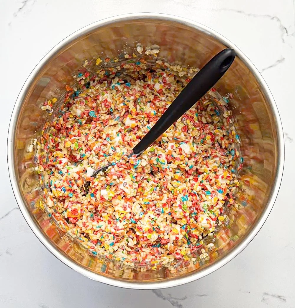 Pour the melted mixture over the cereal, add the remaining (unmelted) marshmallow