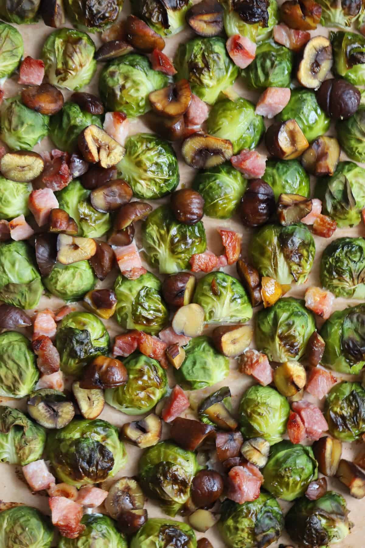 A tray of sprouts, bacon and chestnuts.
