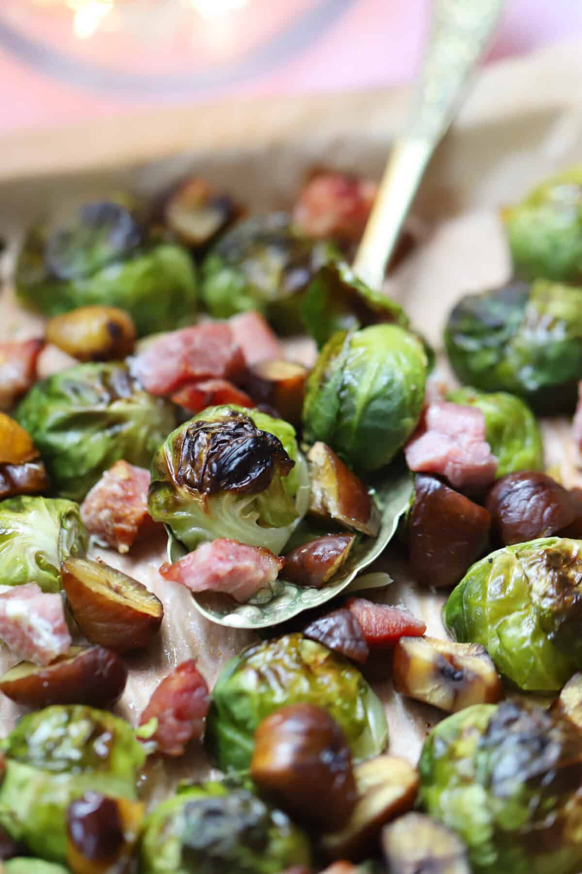 A tray of sprouts, bacon and chestnuts.
