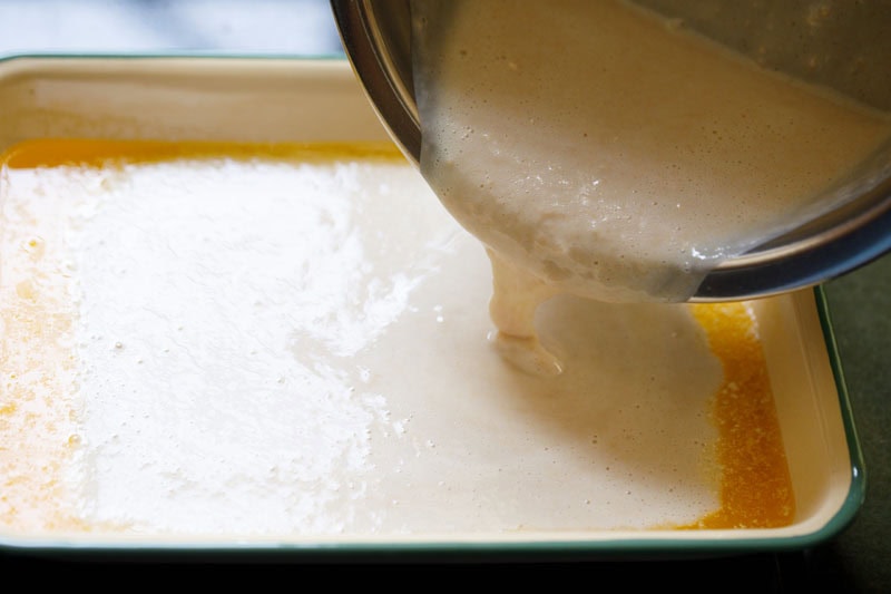 Pouring batter into baking dish.