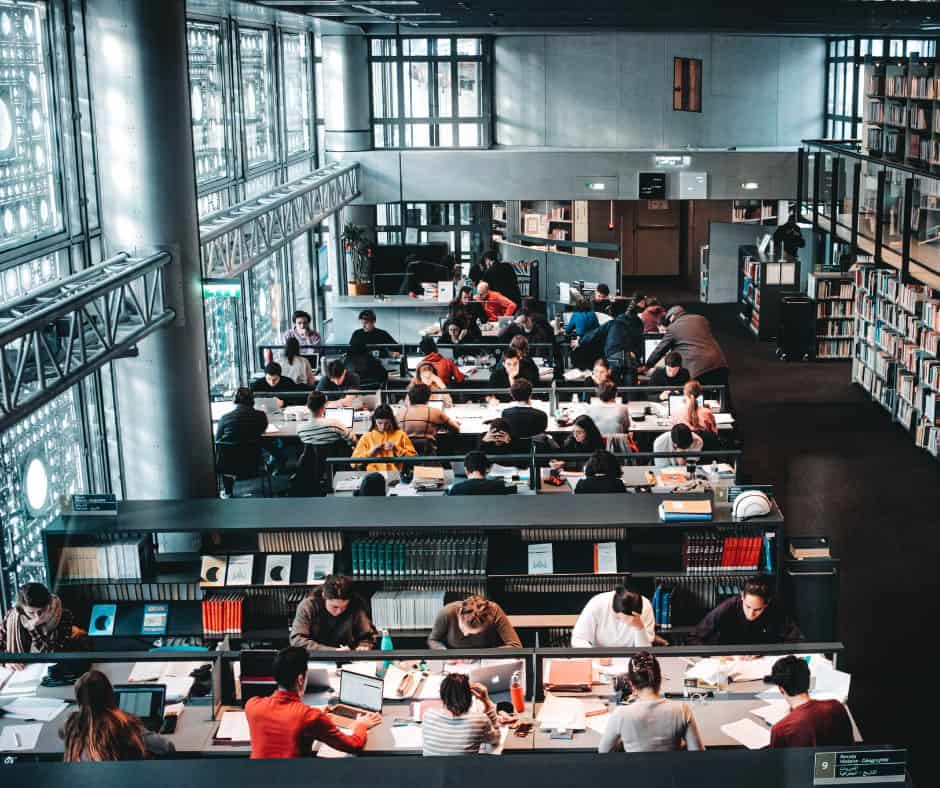 students studying at a college library