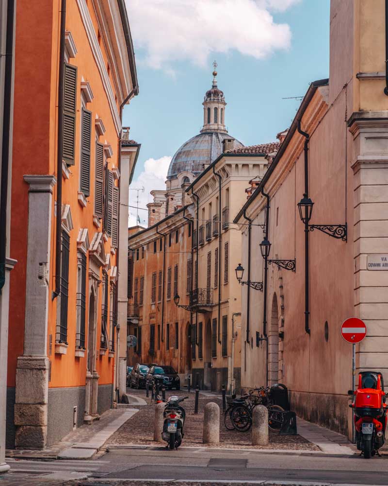 beautiful colorful streets in mantua with basilica in backdrop