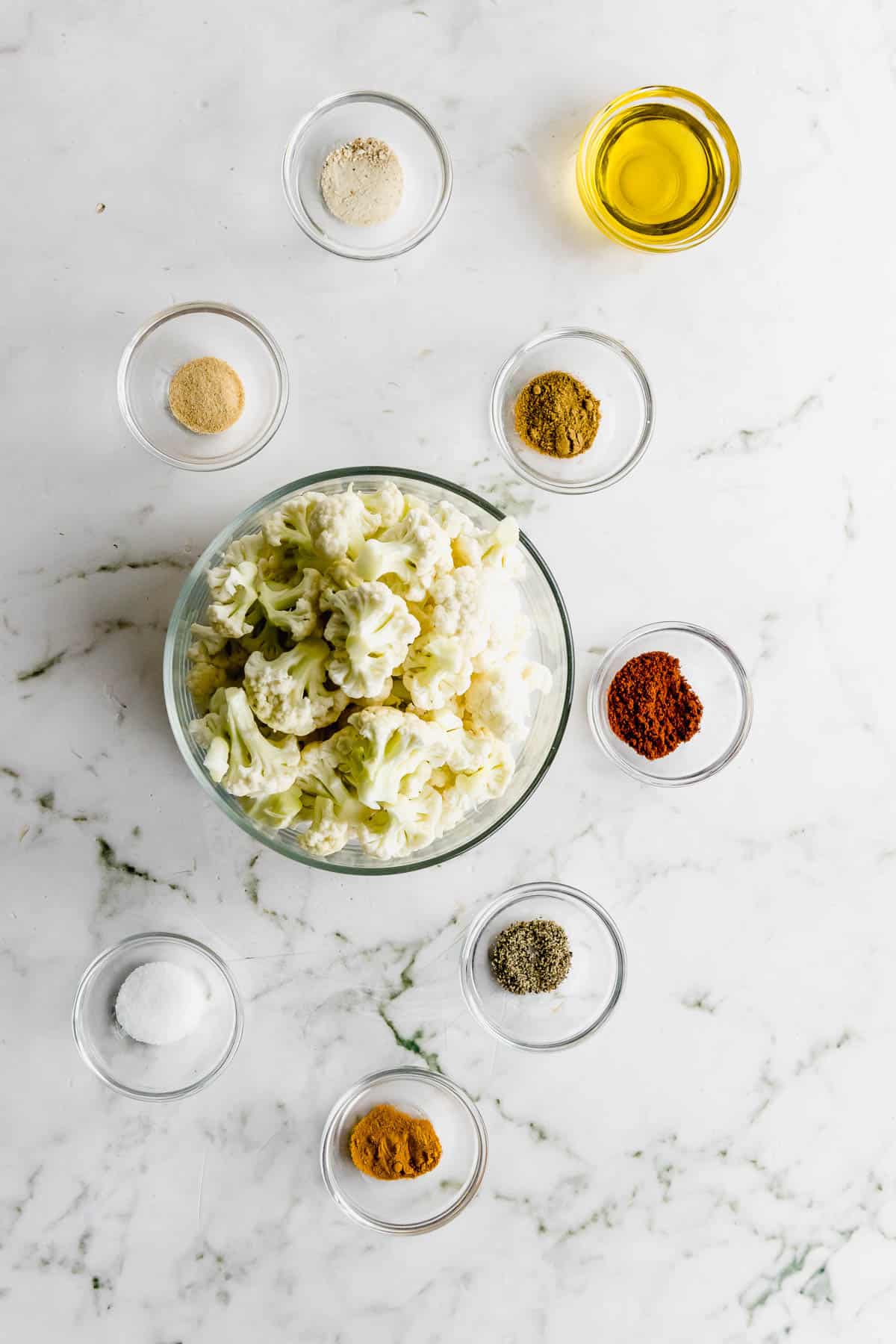 A bowl of ingredients on a marble table.