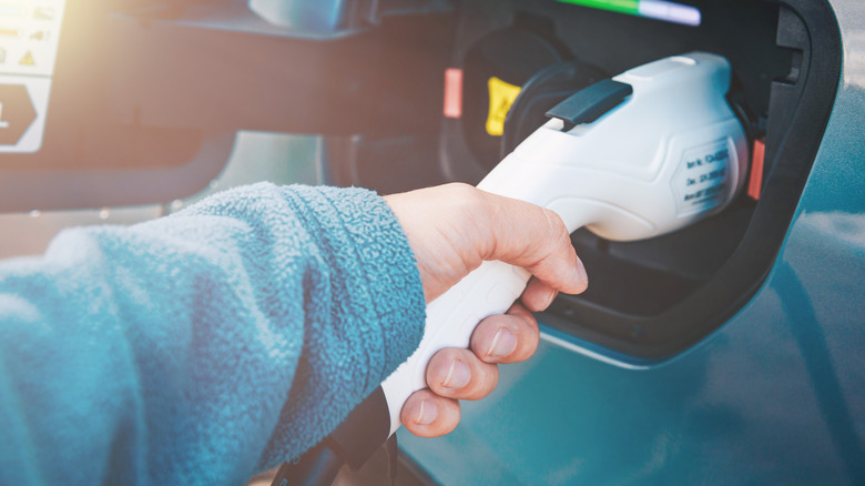 A person charging their electric vehicle