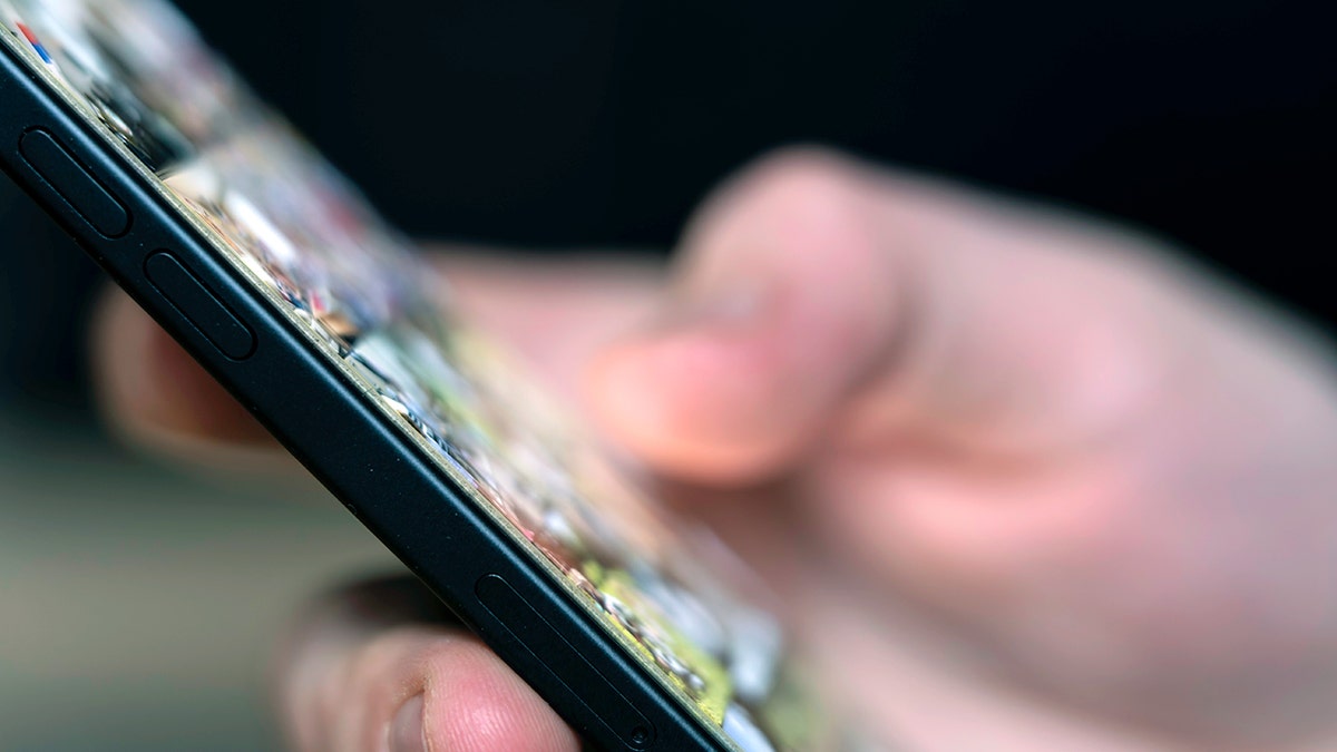 Person using their iPhone.