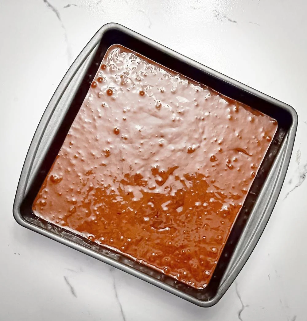 pouring the fudge into the pan