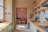 Different muted paint colors elevate the look of a cozy Swedish flat